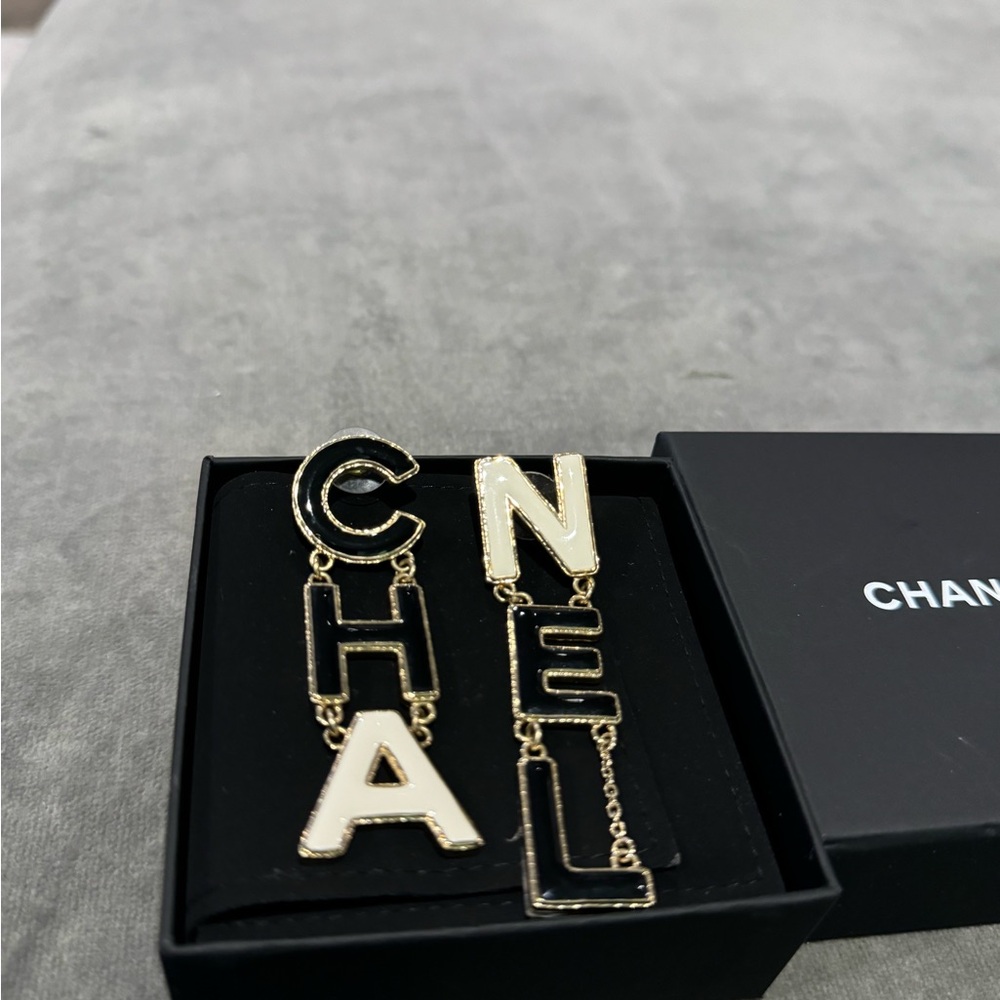 Chanel Drop black, white and gold monogram earrings
